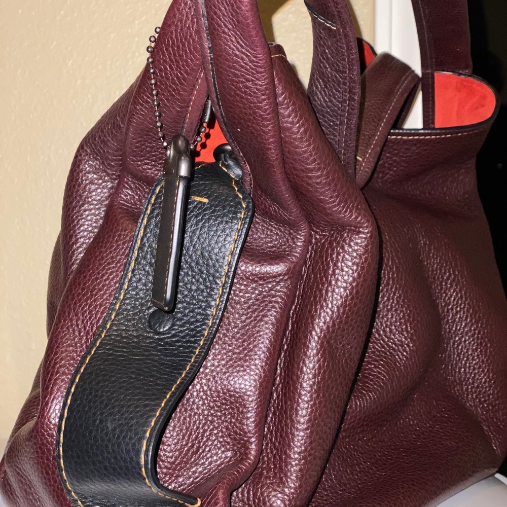 Coach bag. Removable middle section by unsnapping the black strips on outside.